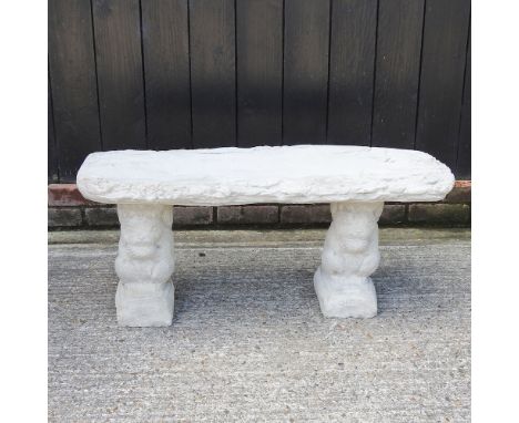 A reconstituted stone garden bench, with supports in the form of squirrels, 98cm