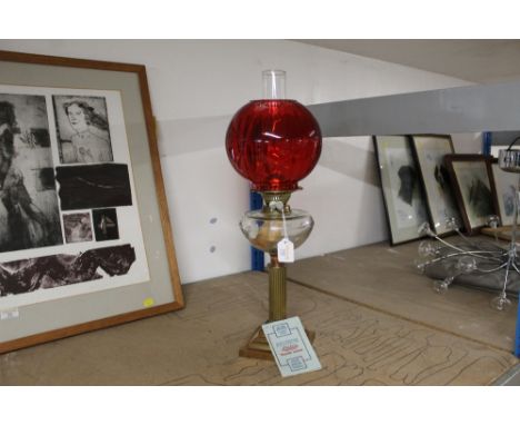 Aladdin oil lamp with red shade and clear glass reservoir 