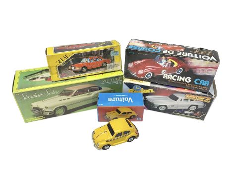 Five tin-plate model cars comprising MF326 Sedan Benz 1956, MF322 Standard Sedan in pink and white, MF763 Voiture de Course r