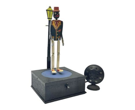 Early 20th century National Co. ‘Microphone Dancing Sam’ battery operated American toy; comprising black wooden dancing figur