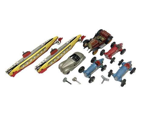 Schuco - seven tinplate model vehicles comprising two 5552 Electro Submarino, two 1050 (2098) racing cars numbered 6 and 8, o