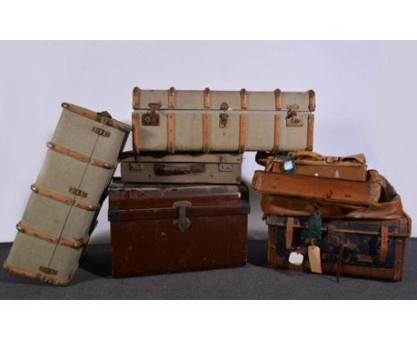 Vintage canvas and leather bound suitcase, (a.f.), canvas bound trunks, cane hampers, tin trunk and suitcases, (9).