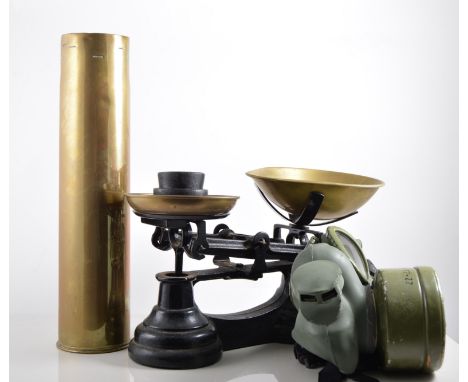 Brass shell cased vases, height 35cm, gas mask, scales and weights, copper coal buckets, lawn bowls, lamps, a part Scalextric