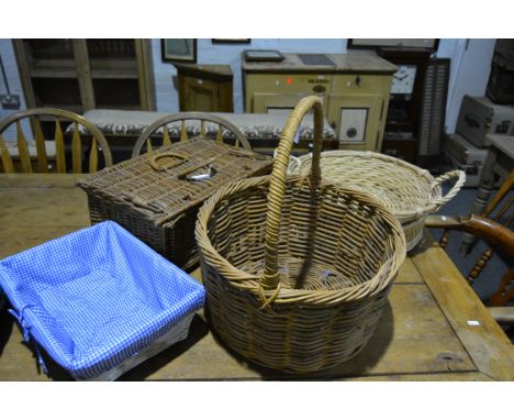 A vintage wicker picnic hamper, a large loop handled basket, two circular baskets and a painted basket (6)