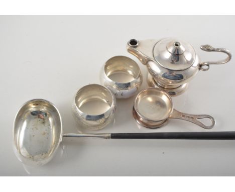 Long handled toddy ladle, together with two silver napkin rings, marks rubbed, six Continental white metal measures, a small 