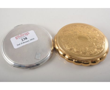 Lady's silver powder compact, Birmingham 1951/52, stamped DM (mirror cracked) together with a musical compact by Kigu (2).