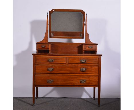 Edwardian mahogany dressing table, arched rectangular bevelled mirror above trinket drawers, base with a moulded edge above t