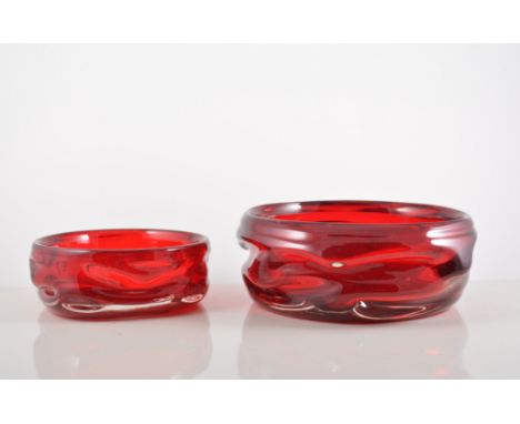 Three graduating Whitefriars ruby glass bowls, by Wilson and Dyer, diameter 20cm and smaller.