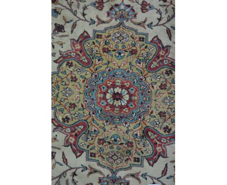 Persian pattern carpet, central floral medallion, pale ground with floral scrolls, meandering border, 370cm x 270cm.