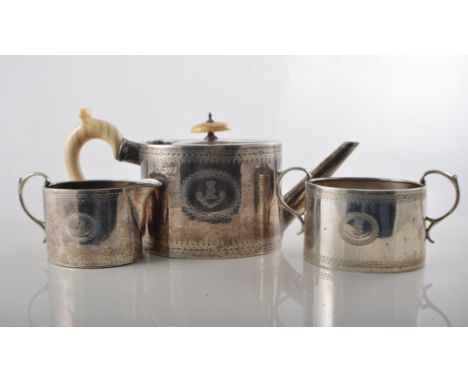 Silver bachelors tea set of straight sided oval form having a bright cut border to top and bottom and crested cartouches, Ivo