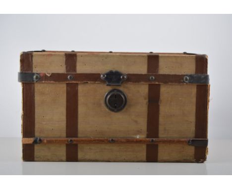 Child's toy cabin trunk, with wooden bands and canvas bound, width 33cm, depth 19cm, height  20cm.