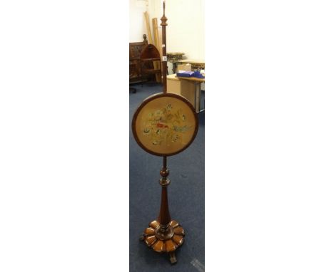 A 19th Century rosewood pole screen, the circular screen with tapestry bird decoration on a platform base (later finial).
