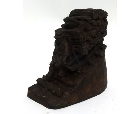 A Black Forest carved wood model of a log carrier with sled, height 17cm.