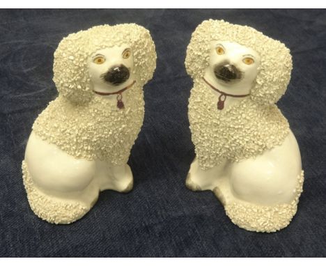 A pair Staffordshire dogs with encrusted decoration, height 12cm also an oil lamp (3).