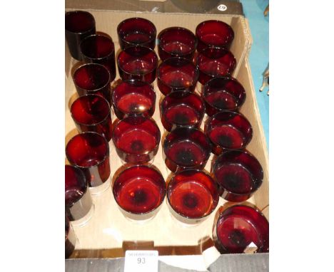 A set of sixteen ruby glass sundae dishes and a set of seven similar wine glasses