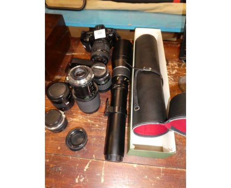 A Minolta 35mm camera and a selection of lenses