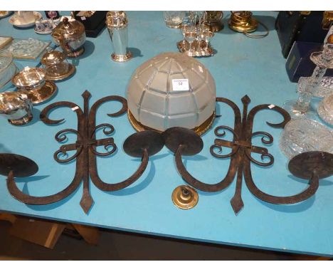 A pair of wrought iron candle wall sconces and an Art Deco glass ceiling light fitting