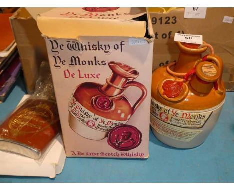 Donald Fisher, a 75.7cl flaggon of DeLuxe whisky in original box, sealed. Also a hip flask