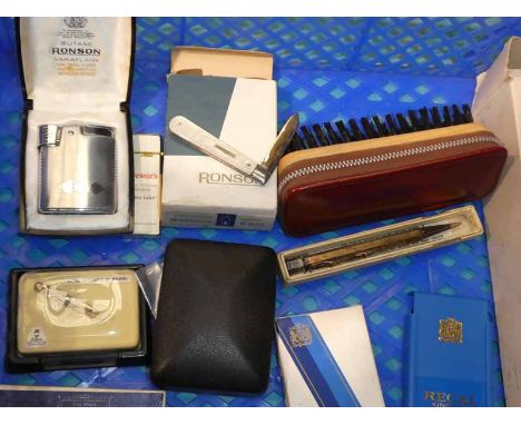 A collection of curios including a cigarette lighter, fruit knives, compact, brushes etc
