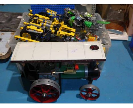 A box of lego and a Mamod model road engine