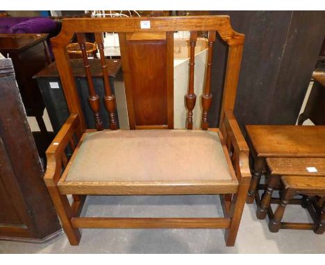 A walnut two seat bench
