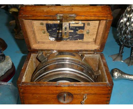 An oak cased pigeon timing clock