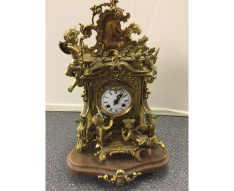 A 19th century-style cherub and fairy clock