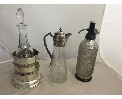 An EPNS claret jug with engraved floral decoration; together with an EPNS soda syphon, ice bucket and decanter