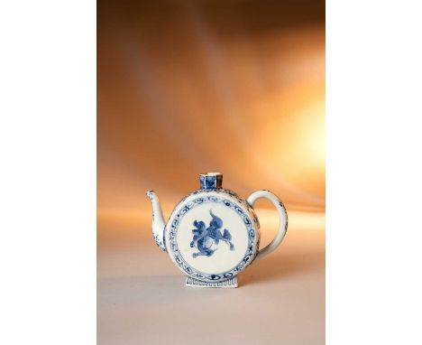 A RARE JAPANESE BLUE AND WHITE DRUM-SHAPED TEAPOT EDO PERIOD, 17TH CENTURYThe unusual flattened circular body raised on a sho