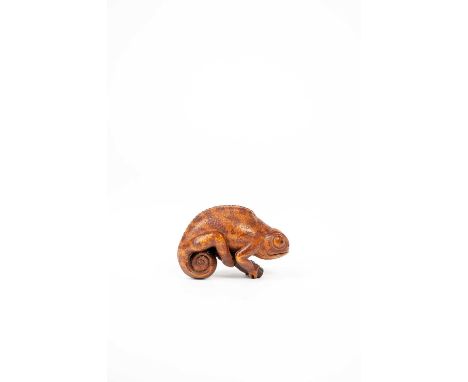 A LARGE BOXWOOD NETSUKE OF A CHAMELEON BY MICHAEL WEBB (1932-2009)C.1980SThe reptile is depicted clambering upon a small twig