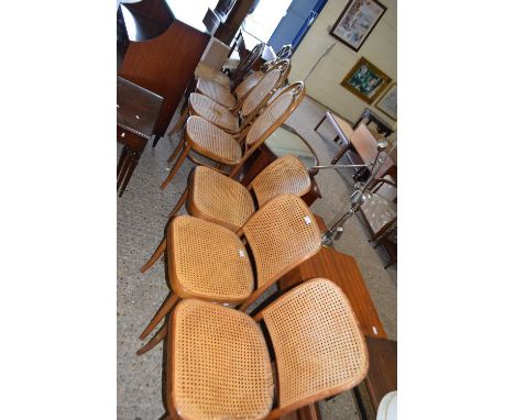 A set of four vintage cane dining chairs together with two similar high back examples (6)