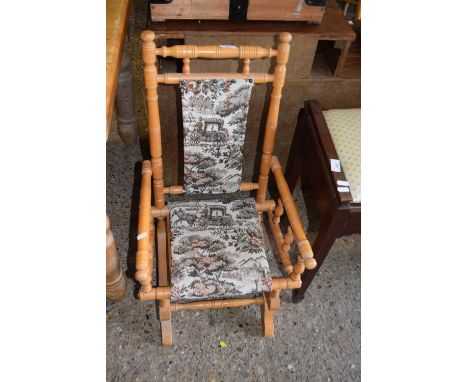 A vintage American style child's rocking chair