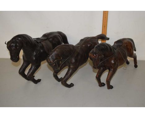 Three vintage leather covered model horses