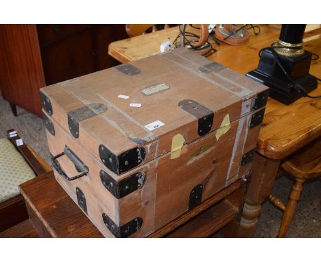 A small pine metal bound trunk