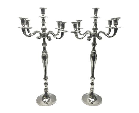 Pair of four branch candelabras, urn-shaped nozzles raised upon scroll branches supported from tapering central stem, with ci