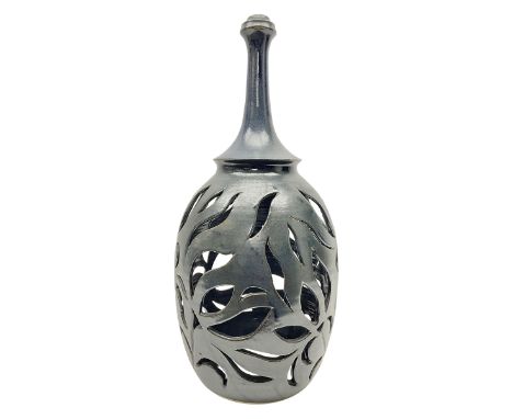 John Egerton (c1945-): studio pottery stoneware lamp base, decorated with pierced floral decoration with a dark blue ground, 