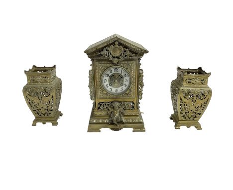 French- early 20th century 8-day  brass cased eight-day mantel clock and pair of pierced brass vases, clock case with an arch