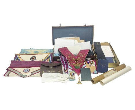 Masonic regalia, including two silver-gilt medals/jewels, centenary medal, aprons, and sash etc, housed in brown briefcase