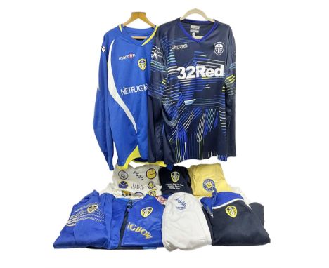 Fourteen items of replica sporting clothing including Leeds United football club shirts, England jerseys etc