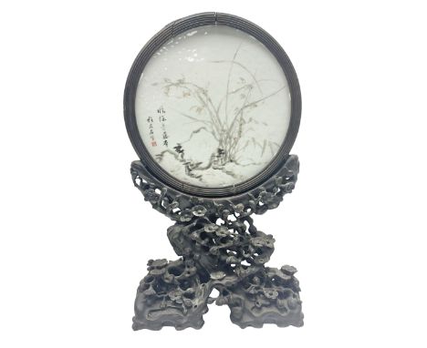 Late 19th century Chinese porcelain circular table screen painted with flowers and leaves and Chinese characters within a flu