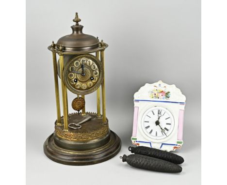 Two antique German clocks. Black Forest porcelain clock, with half-hourly striking, circa 1870. And a brass historicism porta