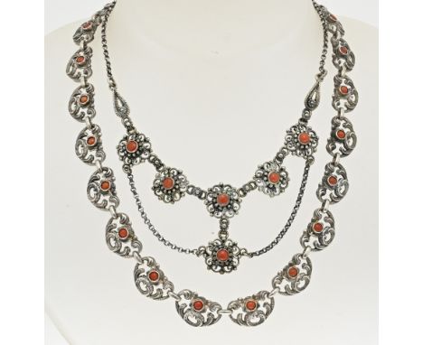 Two silver chokers with blood corals. A necklace with anchor link with a silver element in the middle with 6 flower elements 