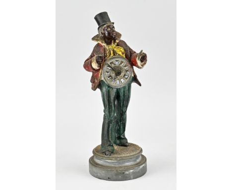 Antique French clock man of composition metal, with original polychromy, alarm clockwork, enamel cartouches. One hand is miss