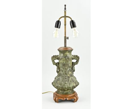 Chinese bronze worked lamp base with green patina. Dimensions: H 70 cm. In good condition.