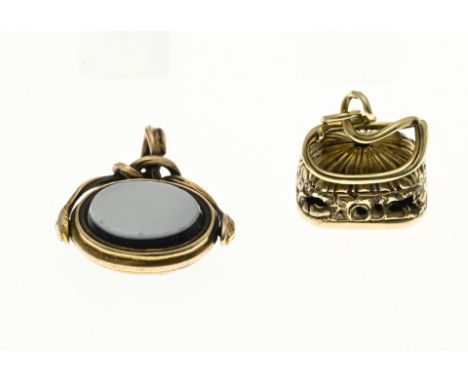 Two sealing seals, signets, with gold. A rectangular seal with an engraving of a coat of arms. 1.5x1.2cm. And a signet with a