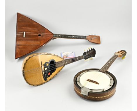 Three old instruments. 20th century. Banjo, lute and balalaika. Size: 60 - 70 cm. In good condition.