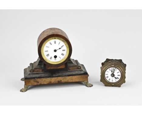 Two antique clocks. 1x Small Biedermeier mahogany pendulum (hand missing). 1x German brass travel alarm clock. Size: 8 - 21 c
