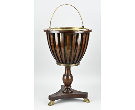 Early 19th century Dutch mahogany tea stove with bronze claw feet. Dimensions: H 51 x Ø 33 cm. In good condition.