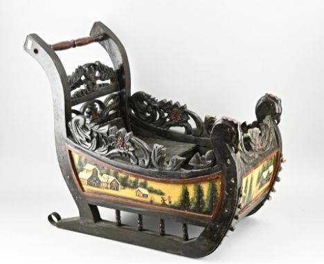 Hardwood carved and hand painted children's sled, after antique example. Dimensions: 60 x68 x 40 cm. In good condition.