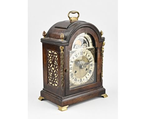 Mahogany table clock with moon phase and bronze frame. Eight-day movement, half-hourly striking. Mid 20th century. Dimensions